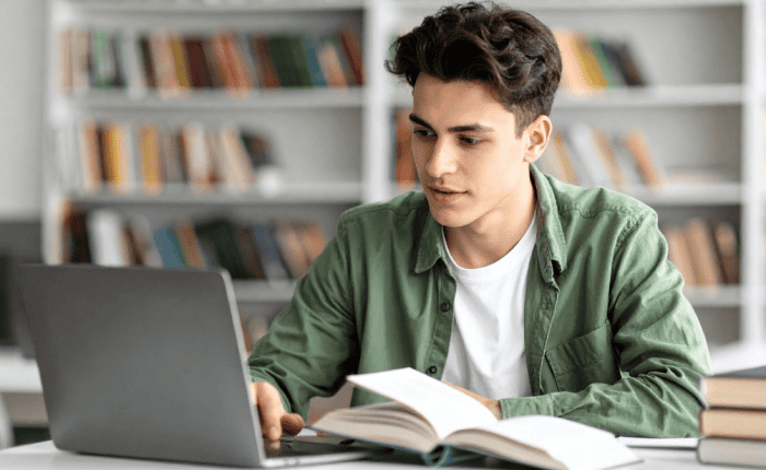 College student looking at computer